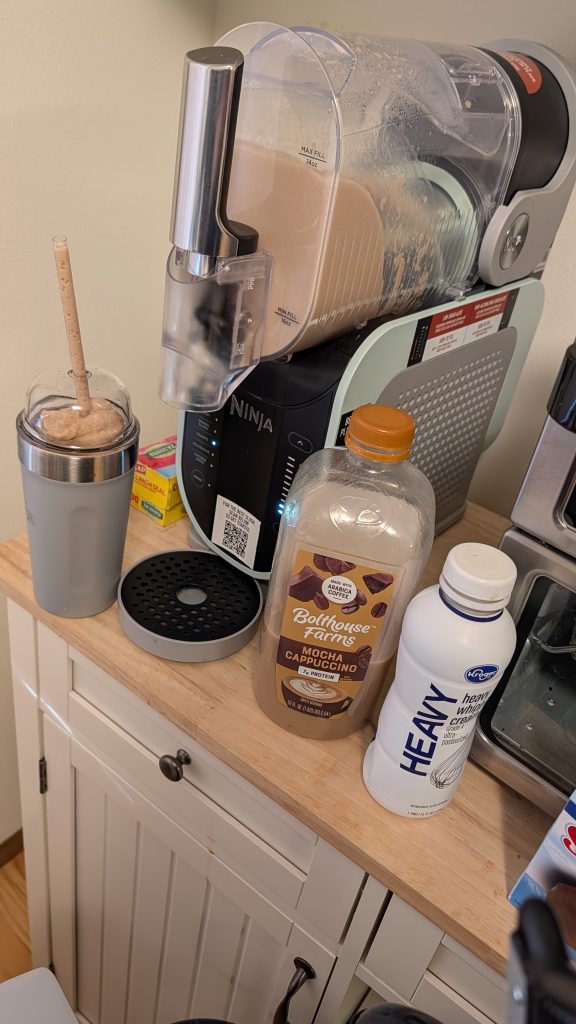 Photo of a Ninja Slushi, with frozen coffee and ingredients